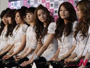 Members of South Korean pop group Girls' Generation attend a news conference before their concert in Seoul